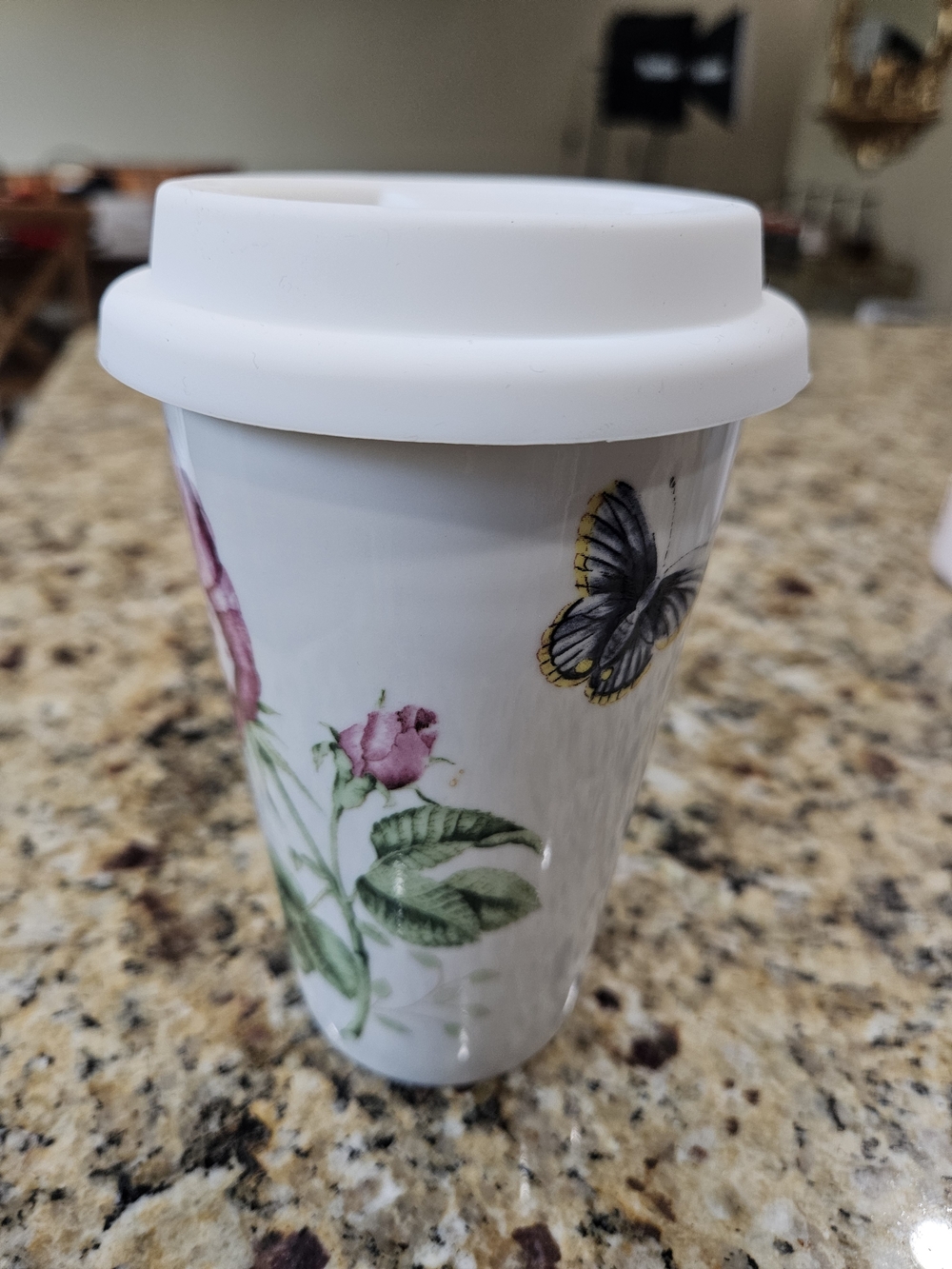 Lenox White Ceramic Travel Mug with Pink Floral and Yellow-Edged Butterfly